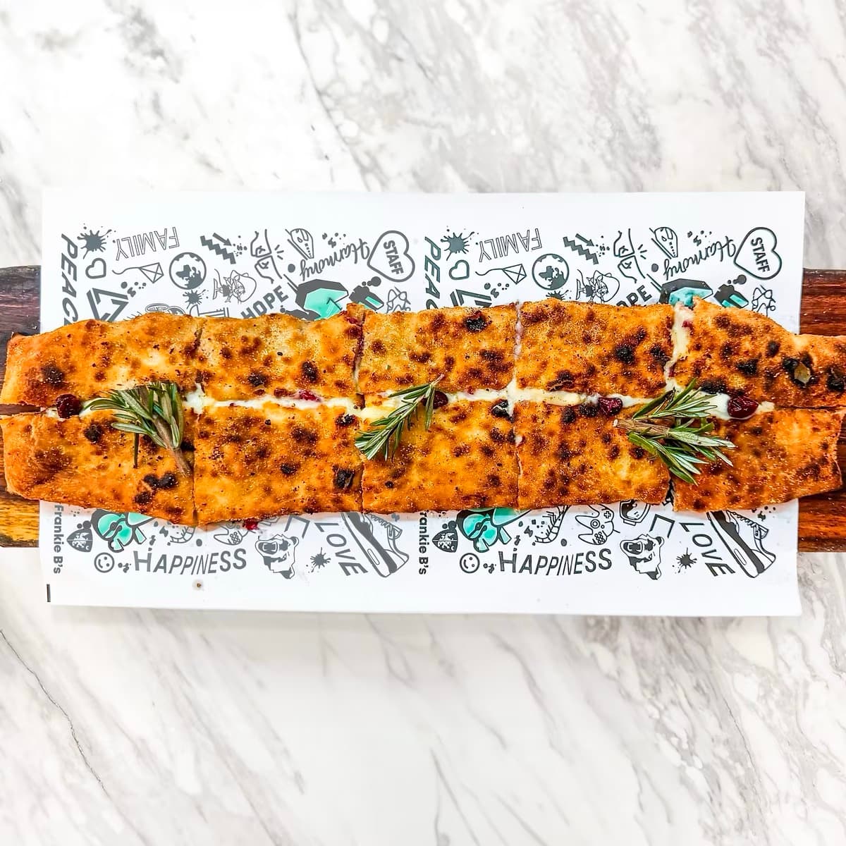 Mozzarella Stick at Frankie B's Food House – Wood-fired pizza stick with mozzarella cheese and garlic sauce