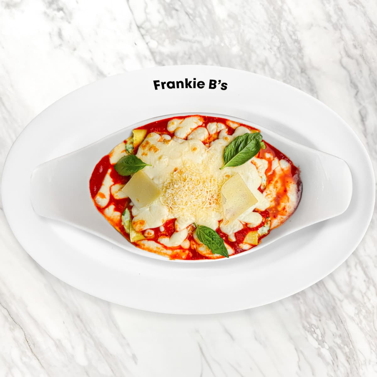 Pranzo baked cannelloni in rich sugo topped with melted cheese and grated parmesan